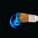 blue paint on a brush